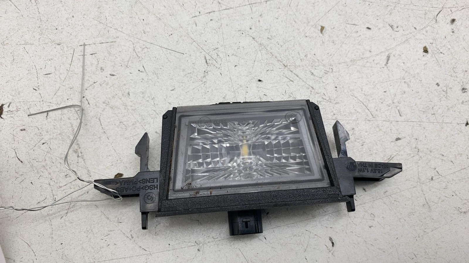 thumbnail image 2 of Nissan OEM Rear License Plate Light Lens & Bulb - Fits 350Z 370Z Cube Versa Leaf 2 of 3