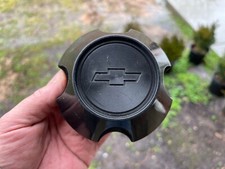 1985-1989 CHEVY SPECTRUM SUNBURST OEM CENTER CAP BLACK 894108641
