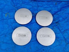 1990-1993 GEO STORM OEM WHEEL CENTER CAP SILVER FINISH 8-94475-490 Set