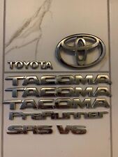 Toyota Tacoma 1998-2004 Tailgate TACOMA Chrome Emblem Genuine OEM   PT211-TC980